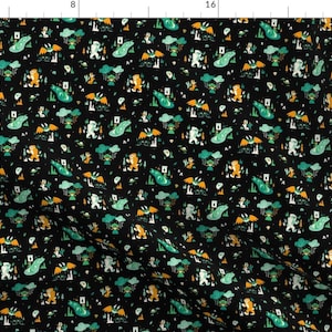 May include: A black fabric with a repeating pattern of green, yellow, and white illustrations of a creature with wings and a creature with a large foot. The pattern is on a black background.