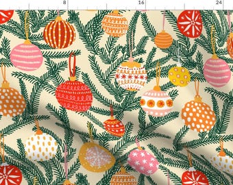 May include: A repeating pattern of Christmas ornaments in various colors, including red, pink, orange, and yellow, against a cream-colored background. The ornaments are hanging from green pine branches, creating a festive holiday design.