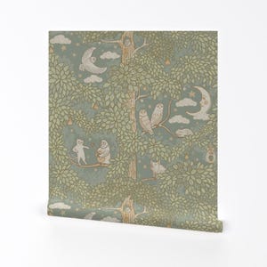 May include: A green and brown wallpaper pattern featuring owls, cats, and a crescent moon. The pattern is repeated throughout the wallpaper, creating a whimsical and charming design.