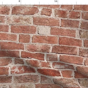 May include: A close-up of a red brick wall with white mortar. The bricks are arranged in a staggered pattern, creating a textured surface.