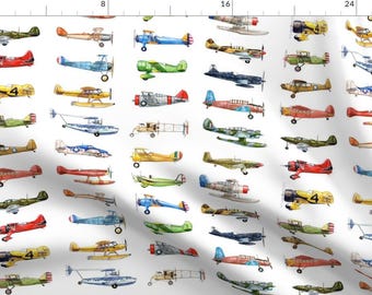 May include: A white background with a repeating pattern of watercolor illustrations of various vintage airplanes in different colors. The airplanes are all facing the right side of the image.