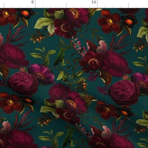 May include: A teal background with a repeating pattern of dark red and purple flowers. The flowers are arranged in a random pattern and are surrounded by green leaves.