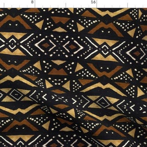May include: Black fabric with a repeating geometric pattern in brown, tan, and white. The pattern features triangles, diamonds, and zigzags.