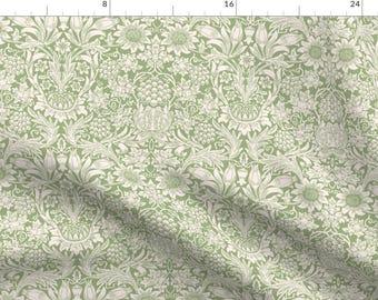 Pode incluir: Um tecido verde com um padrão floral branco. O padrão apresenta flores, folhas e caules estilizados.