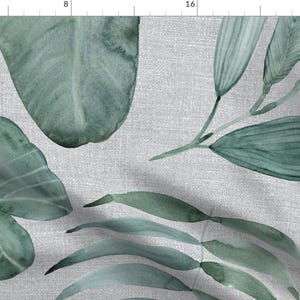 May include: A seamless pattern featuring watercolor illustrations of green leaves on a light gray linen background. The leaves are arranged in a random pattern and are of various sizes and shapes.
