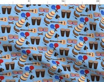 May include: A seamless pattern featuring a variety of Puerto Rican cultural icons, including maracas, congas, guitars, and the Puerto Rican flag. The pattern is set against a light blue background.