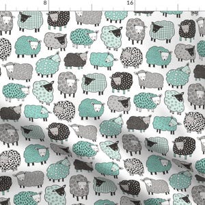 May include: A white fabric with a repeating pattern of black and grey sheep with mint green accents. The sheep are all different shapes and sizes and have different patterns on their wool.