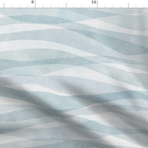 May include: Abstract watercolor pattern with light blue and white wavy lines. The pattern is seamless and can be used for a variety of projects, such as fabric, wallpaper, and wrapping paper.