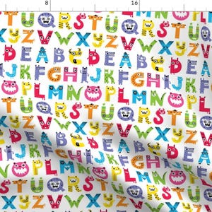 May include: A white background with a repeating pattern of colorful letters of the alphabet. Each letter is surrounded by a cartoon monster with different colors and features.