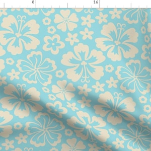 May include: A seamless pattern featuring white hibiscus flowers on a light blue background. The flowers are arranged in a repeating pattern, creating a tropical and summery feel.