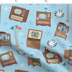 May include: A light blue background with a repeating pattern of vintage televisions, atomic clocks, and starburst designs. The televisions are in various styles and colors, including brown, black, and white. The clocks are all round and have colorful accents. The starbursts are in a variety of sizes and are all white.