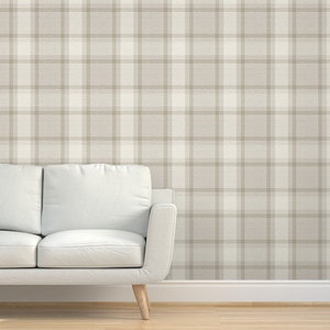 May include: A white and beige plaid wallpaper with a subtle texture. The wallpaper has a light brown background with white and beige plaid pattern.