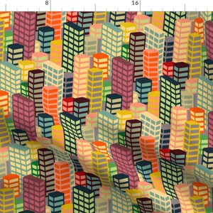 Peut inclure: Un motif coloré de bâtiments géométriques dans des tons de rouge, orange, jaune, vert, bleu et violet. Les bâtiments sont disposés en un motif répétitif, créant une impression de profondeur et de perspective.