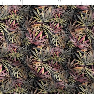 May include: A seamless pattern featuring a repeating design of stylized cannabis leaves in shades of pink, yellow, and gray on a black background.