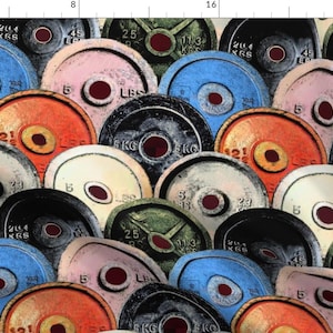 May include: A fabric pattern featuring a collage of colorful weight plates. The plates are in various colors, including blue, orange, pink, and green, with measurements in pounds and kilograms. The design has a vintage, distressed look, suitable for fitness-themed projects.