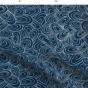 May include: A seamless pattern featuring a navy blue background with white abstract shapes that resemble overlapping circles and ovals.