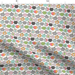 May include: A white background with a repeating pattern of colourful apples. Each apple is a different design, with some having stripes, polka dots, or a simple outline. The apples are in various shades of red, orange, green, blue, and black.