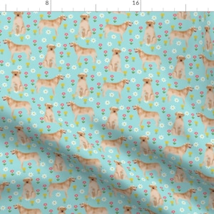 May include: A seamless pattern featuring golden labrador retrievers on a light blue background with white, pink, and yellow flowers.