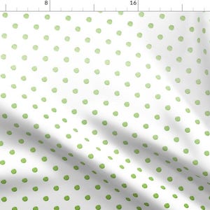 May include: White fabric with a repeating pattern of green polka dots. The dots are slightly faded in a gradient from dark green to light green.