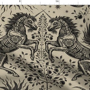 May include: A black and white illustration of two skeletal unicorns facing each other. The unicorns are surrounded by floral designs and stars. The background is a light beige.