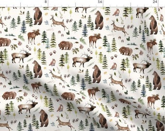 May include: Off-white fabric with a repeating watercolor pattern of forest animals and trees. Bears, deer, moose, and foxes are depicted in shades of brown and tan, interspersed with green and blue-green trees and paw prints.