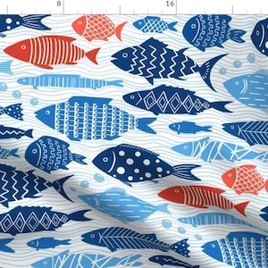 May include: A white background with a repeating pattern of blue and red fish. The fish are stylized and have different patterns. Some fish have polka dots, some have stripes, and some have geometric patterns. The fish are swimming in a wavy pattern.