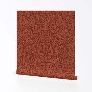 May include: A red wallpaper with a repeating pattern of oak leaves, acorns, and flowers. The pattern is in a traditional style.