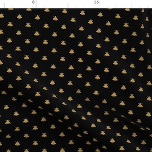 May include: Black fabric with a repeating pattern of gold bees.