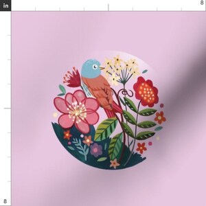 May include: A pink background with a circle containing a blue and orange bird, pink, red, and yellow flowers, and green leaves.