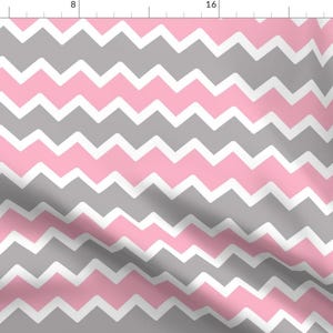 May include: A pink and gray chevron pattern fabric. The pattern is made up of alternating pink and gray zigzags.