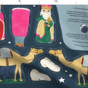 May include: A set of felt Christmas ornaments to make, including three wise men, camels, a sheep, and a star. The instructions are printed on the fabric.
