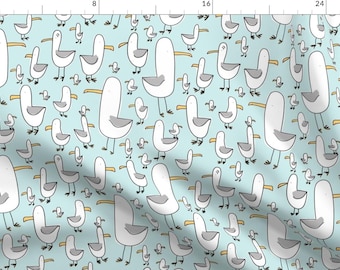 May include: A seamless pattern featuring white seagulls with yellow beaks on a light blue background. The seagulls are drawn in a simple, cartoon style and are arranged in a random pattern.