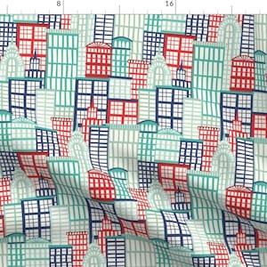 Puede incluir: Un patrón sin costuras que presenta un diseño repetitivo de edificios coloridos con acentos rojos, azules y verdes. Los edificios están dispuestos en un patrón de cuadrícula y tienen un estilo caprichoso y de dibujos animados.