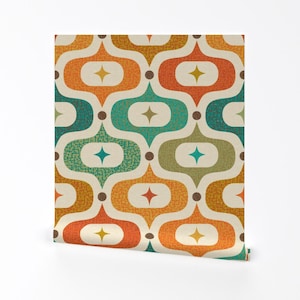 May include: A seamless pattern featuring a repeating geometric design of teardrop shapes in shades of orange, green, brown, and beige. The teardrop shapes are outlined in white and have a starburst design in the center.