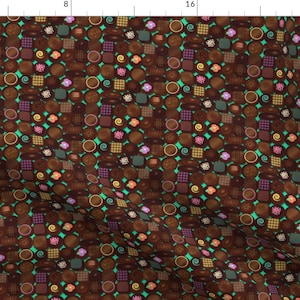 May include: A seamless pattern featuring a variety of chocolate candies in different shapes and sizes. The candies are arranged in a repeating pattern on a turquoise background.