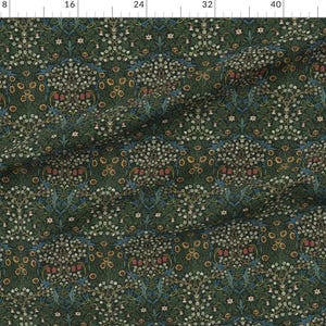 May include: Dark green fabric with a repeating floral pattern. The design features white, yellow, and red flowers, along with blue accents. The fabric has a vintage or antique aesthetic, suitable for various craft projects.
