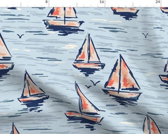 May include: A blue and white fabric with a repeating pattern of red and orange sailboats on a blue and white wavy background.