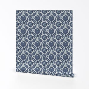 May include: A blue and white damask pattern wallpaper with a repeating floral design.