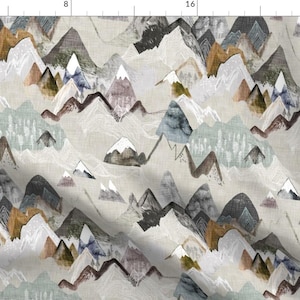 May include: A seamless pattern featuring a repeating design of abstract mountains in shades of grey, blue, brown, and white. The mountains are layered and overlapping, creating a sense of depth and dimension. The background is a light grey.