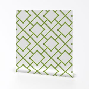 May include: Green bamboo trellis pattern wallpaper with a white background. The pattern is made up of overlapping squares and diamonds.