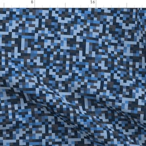 May include: A blue and black pixelated pattern fabric. The fabric has a diagonal pattern and is made up of small squares.