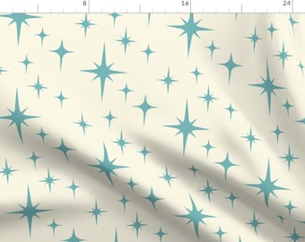May include: A seamless pattern featuring teal blue starburst shapes on a cream background. The pattern is perfect for fabric, wallpaper, or wrapping paper.