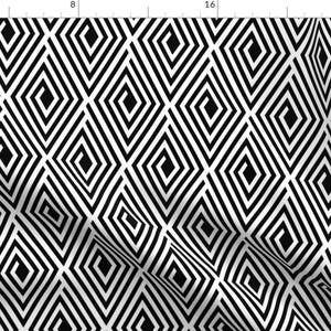 May include: Black and white geometric pattern with a repeating diamond shape design. The diamonds are made up of concentric squares.