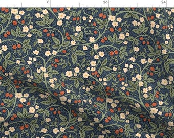 May include: Dark blue fabric with a repeating pattern of white flowers, green leaves, and red berries. The design features winding vines and a dense, all-over floral arrangement. The fabric is suitable for various sewing projects.