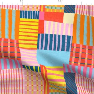 May include: A colorful patchwork fabric with a variety of stripes and checkered patterns in shades of red, orange, yellow, blue, pink, and white.