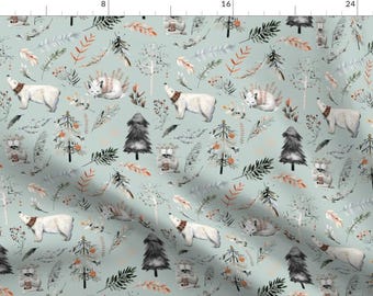 May include: A seamless pattern featuring a variety of woodland creatures, including polar bears, foxes, and raccoons, on a light blue background. The pattern also includes trees, leaves, and feathers.
