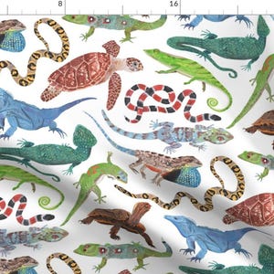 May include: A white background with a repeating pattern of colorful lizards, snakes, and turtles. The pattern includes a red-bellied turtle, a blue iguana, a green iguana, a red and black snake, and a variety of lizards in shades of green, blue, and brown.