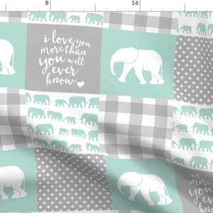 May include: A patchwork fabric featuring elephant designs in white and teal on a gray and white background. The design includes gingham, polka dots, and the text "i love you more than you will ever know."