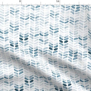 May include: A white background with a repeating pattern of blue and gray watercolor brushstrokes in a herringbone design.