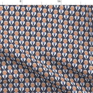 May include: A repeating pattern of a man's face on a dark blue background. The man is wearing a white shirt, a dark blue tie, and a dark blue suit jacket.